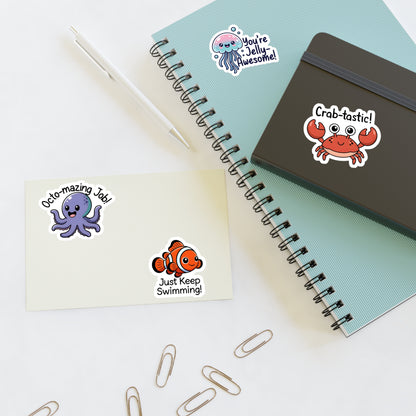 Stickers with cartoon characters on a notebook and paper.
